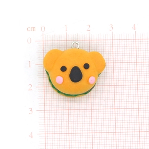 Macro detail of koala animal burger charm with scale measurement for DIY crafts