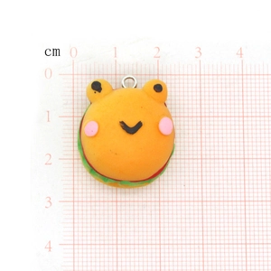 Detail of creative frog burger charm showing layered design and dimensions on grid paper