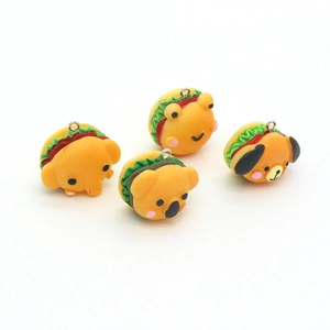 Detailed view of resin animal burger charms including elephant frog koala and dog designs