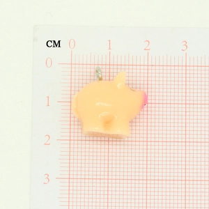 Detailed size view of a pink resin pig pendant with dimensions on a CM measurement scale