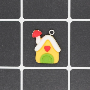 Detail of mushroom house resin pendant with red heart and silver DIY connector ring