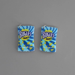 Macro detail of miniature resin Bugles snack charms with silver jump rings for DIY jewelry