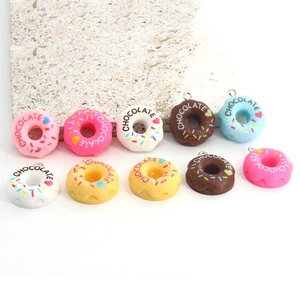 Colorful resin donut charms with chocolate text and heart patterns for DIY jewelry making