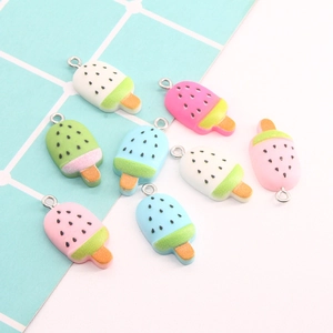 Flat lay of colorful resin popsicle charms with metal loops for DIY jewelry making