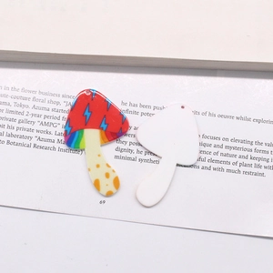 Detailed macro view of acrylic mushroom pendants for DIY jewelry making and crafts