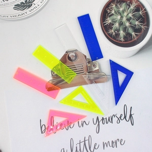 Flat lay of colorful translucent acrylic mini rulers and triangle set for DIY jewelry