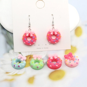 Sweet resin donut earrings with bow designs and colorful sprinkles in pastel tones