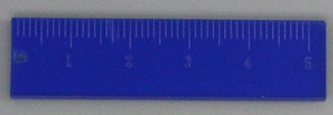 Close-up of a blue acrylic ruler charm with white scale markings and a hanging hole