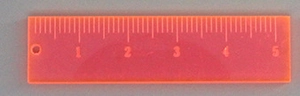 Transparent orange acrylic mini ruler pendant with black centimeter scales and a hanging hole