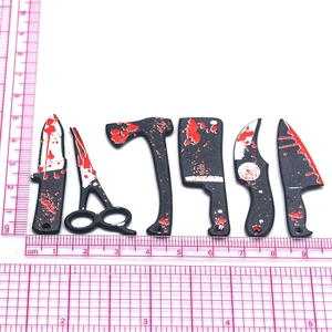 Set of spooky Halloween weapon pendants with realistic red blood splatters for DIY jewelry