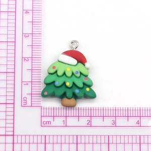 Macro view of cartoon Christmas tree pendant with scale showing 2.5cm size details