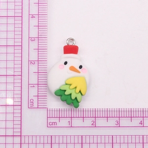 Detail of DIY snowman pendant charm with dimensions on a measuring mat for size reference