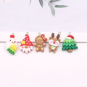 Five assorted Christmas pendants including snowman, Santa, and reindeer for DIY jewelry