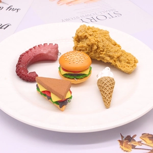5-piece PVC food keychain set including burger, fried chicken and ice cream on a plate
