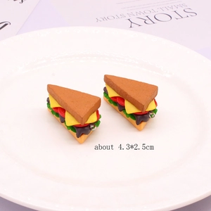 Detailed view of miniature PVC sandwich pendants featuring multi-layer food ingredients