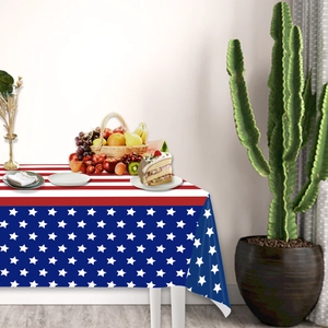 Detail of USA flag stars and stripes tablecloth with festive party snacks and decor