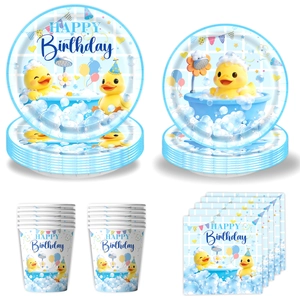 Detail of yellow duck party tableware including paper plates, cups, and napkins with happy birthday