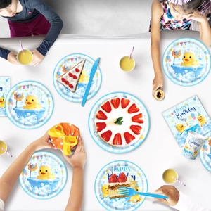 Yellow rubber duck birthday party supplies set including plates, napkins, and cups