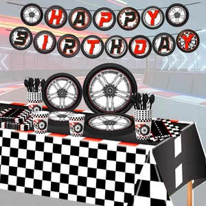 Racing car themed birthday party set with tire pattern plates and checkered tablecloth