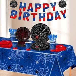Spider web themed birthday party set with paper plates cups banner and blue tablecloth