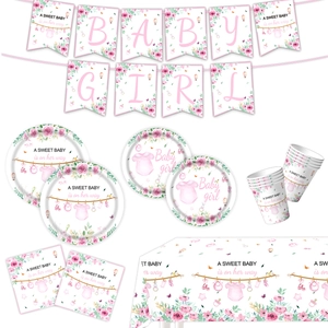 Detail of floral Baby Girl party supplies including plates, cups, napkins and banner