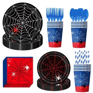 Detailed flat lay of spider web themed party plates, cups, and cutlery set