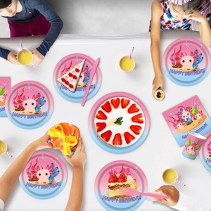 Flat lay of pink axolotl party tableware set with paper plates cups and napkins