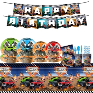 Detailed view of monster truck birthday party set with banners, plates and tablecloth