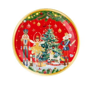Plato de papel de Cascanueces navideño con soldados y borde dorado en fondo rojo