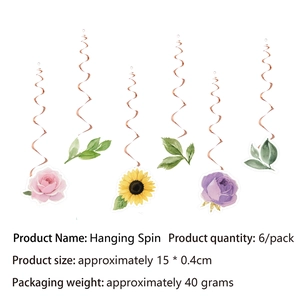 Close-up of six hanging swirl decorations featuring vibrant floral patterns for parties