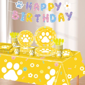 Detailed set of dog paw party tableware including paper plates and napkins with daisy theme