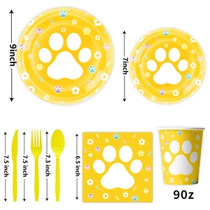 Detailed view of yellow paw print party tableware set with specific size measurements