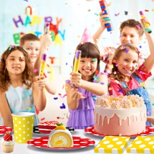 Polka dot birthday party supplies set with colorful paper plates cups and napkins