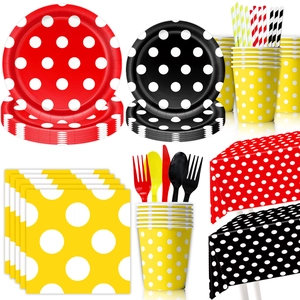 Colorful polka dot party tableware set including paper plates, cups and straws on white background