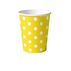Bright yellow disposable paper cup with white polka dots for birthday party decoration