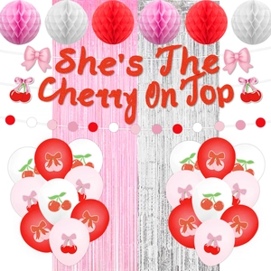 Detail of She's The Cherry On Top banner with red glitter letters and cherry themed party decor