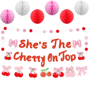 She's The Cherry On Top banner with glittery cherry garlands and honeycomb balls decoration