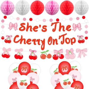 Close-up of 'She's The Cherry On Top' glitter banner and cherry party decoration set