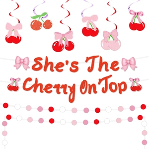 Close-up of Cherry themed party kit with glitter banner and spiral cherry ornaments