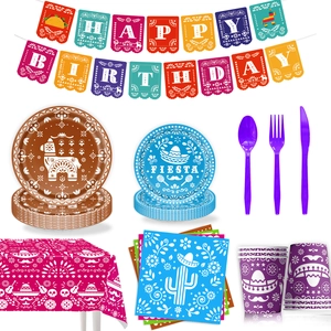 Flat lay of Mexican Fiesta party set including banner, plates, napkins and tablecloth