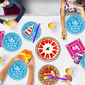 Detail of Fiesta party tableware featuring Mexican sombreros and maracas on paper plates