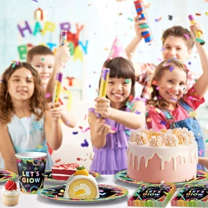 Neon Let's Glow themed party tableware set displayed at a kids' birthday celebration
