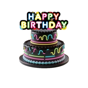 Neon Happy Birthday cake topper with colorful rainbow letters on a chocolate cake