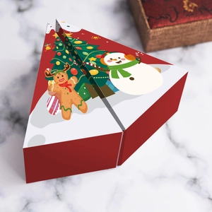 Detailed view of Christmas themed triangular candy boxes with gingerbread and snowman patterns