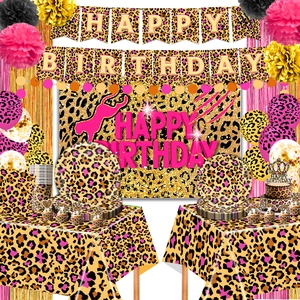 Detail of pink leopard birthday party set with banners, plates, and balloons