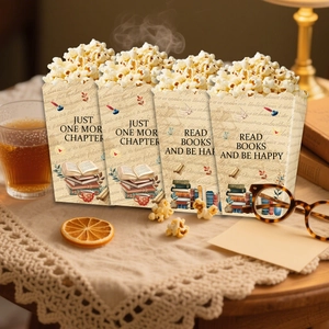 Detail of vintage book-themed popcorn boxes with Just One More Chapter text and illustrations