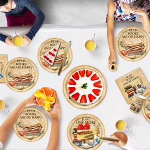 Detail of vintage book theme party tableware set with paper plates and napkins