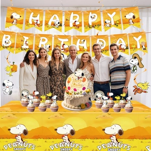 Detailed set of Snoopy birthday party banners, cake toppers and yellow table cloth