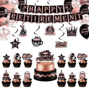 Detail view of rose gold retirement party set with banners, balloons and cake toppers