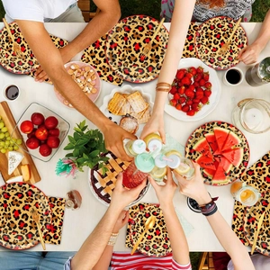 Close-up of leopard print disposable party plates and napkins for festive table settings